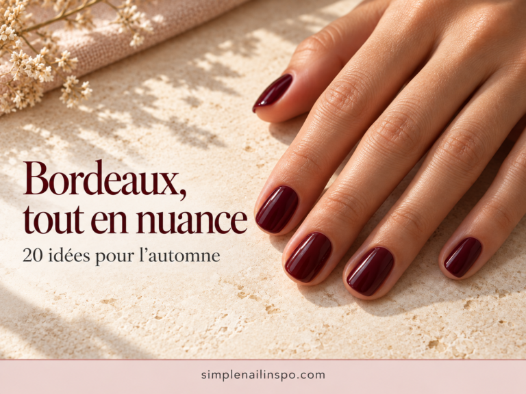 Ongles bordeaux pour l’automne avec une finition brillante et une forme courte élégante.