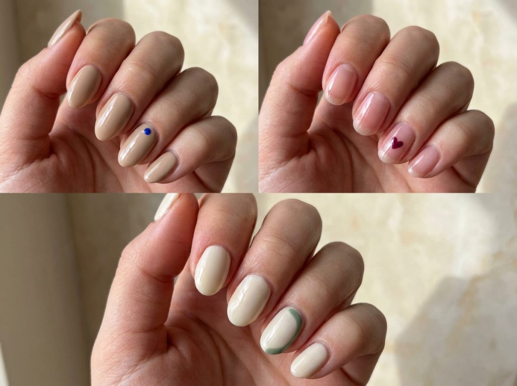 A cobalt dot, a berry heart and a muted green arc add color to neutral nails.
