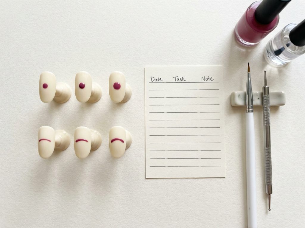 Practice tips record small variations in berry dots and curves on a cream base.