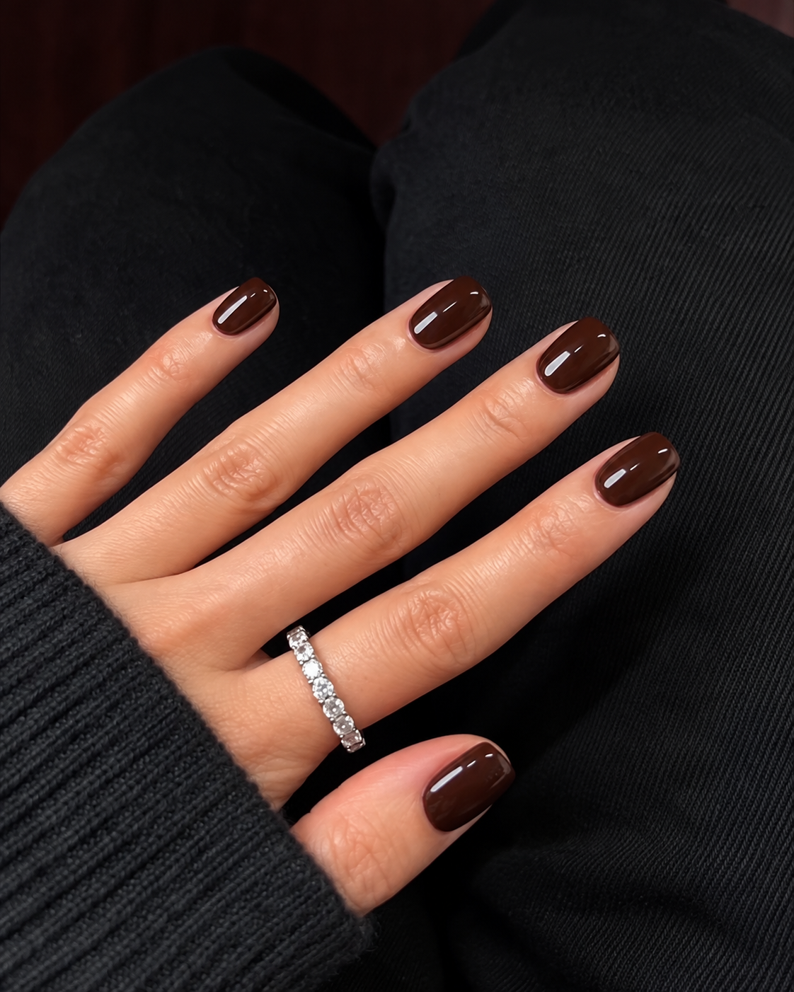 Short soft-square nails painted glossy espresso brown.