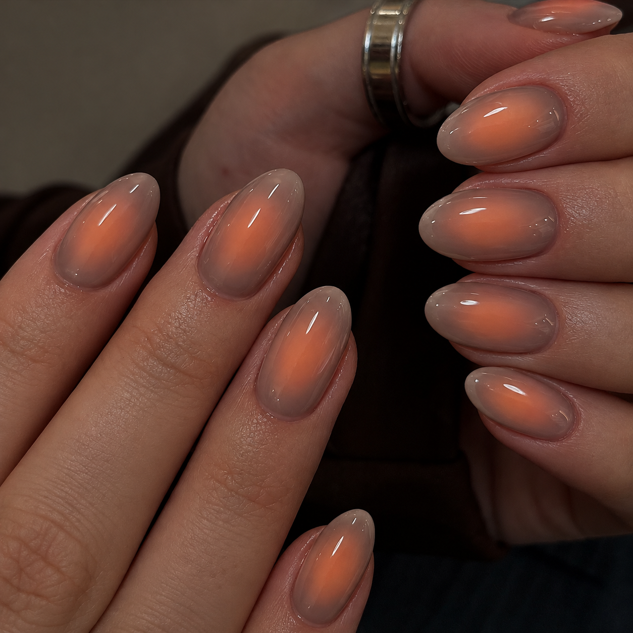 Short taupe nails with softly blended apricot centers.