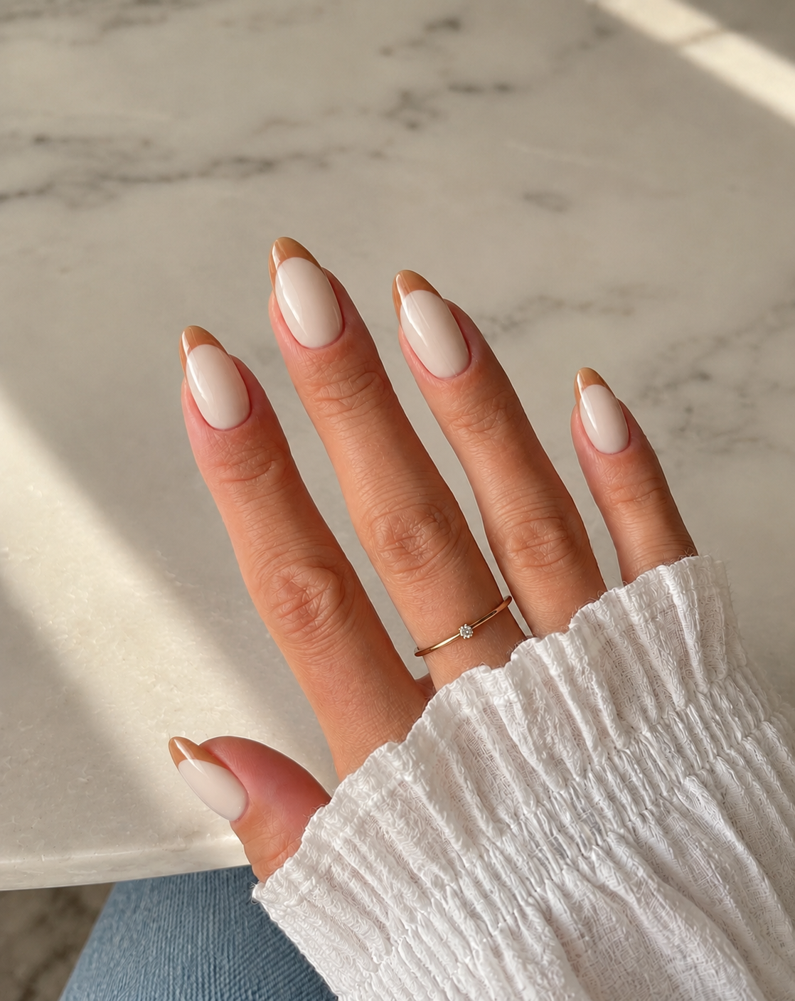 Short soft-square nails with creamy oat bases and rounded honey-beige French tips.
