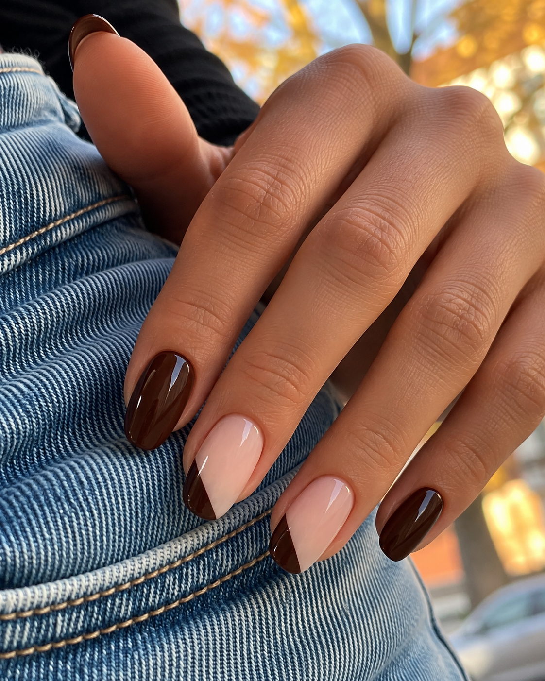 Espresso nails with nude middle and ring fingers featuring diagonal espresso tip-corner blocks.